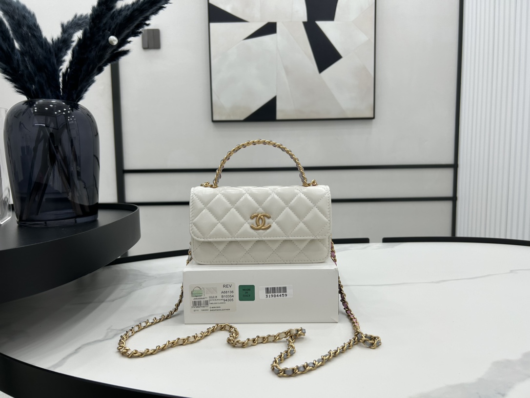 Chanela68136smallflapbagwithtophandleshinylambskingoldtonemetalwhitejpg 11 replica designer bags online store